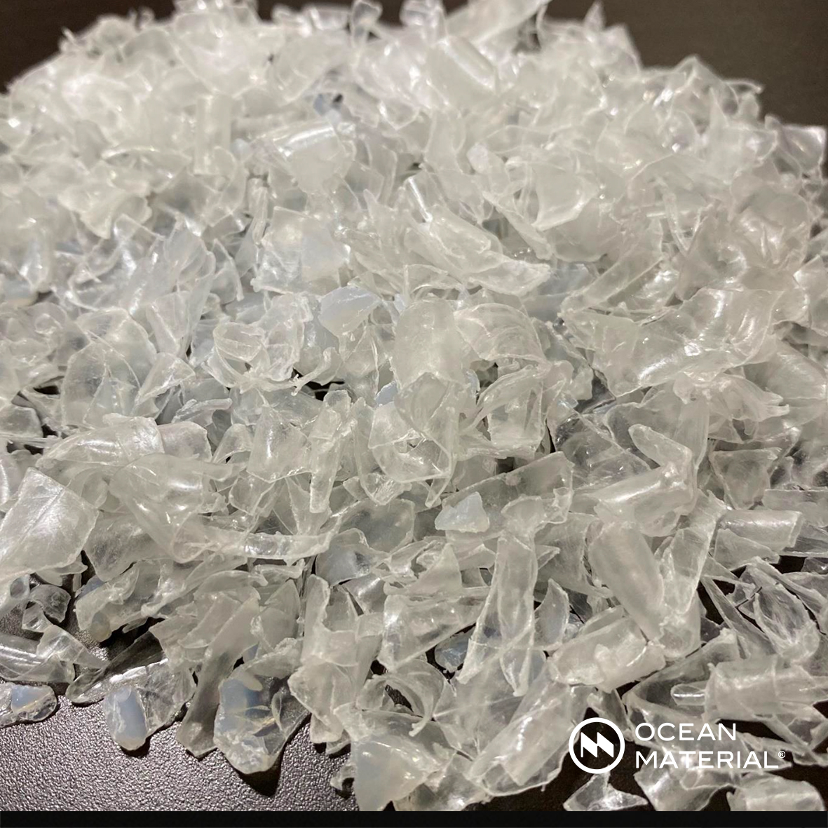 Ocean Material® logo in three color variations